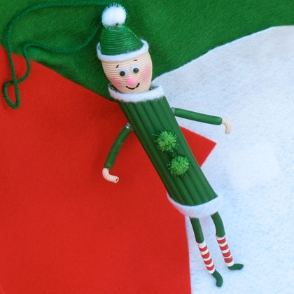 pasta-elf - 13 Easy Christmas Ornaments for Kids to make with pasta - Pasta angels, pasta elf, pasta gingerbread house, fun and easy pasta ornament craft ideas. 