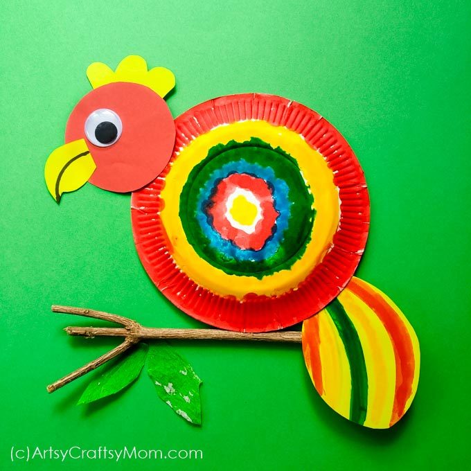 This Paper Plate Parrot Craft is the perfect project for a rainforest or bird unit at home or at school for Preschoolers. Watch their happy faces as they transform a plate into a colorful bird.