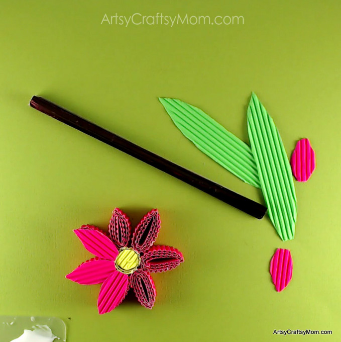 Learn how to make these 3D Corrugated Sheet Quilled Flowers. Corrugated cardboard adds a lovely texture to crafts and is easy for kids to fold. #kokorupaper