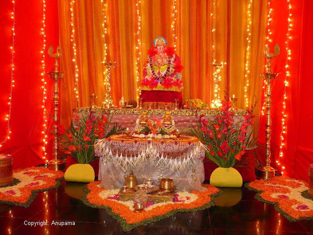  Decorating the ganesha mantap | via ArtsyCraftsyMom.com - Ganesh Chaturthi Crafts and Activities to do with Kids - Make a Clay Ganesha, decorate, Ganesha's throne & umbrella, rangoli ideas, recipes, books and more