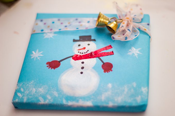 Homemade Christmas wrapping paper Sponge Stamped Snowman Craft