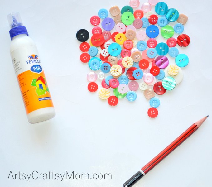 Ramp up your home's Easter decor with this easy Easter Egg Button Wall Art that even kids can make!