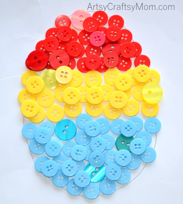 Ramp up your home's Easter decor with this easy Easter Egg Button Wall Art that even kids can make!