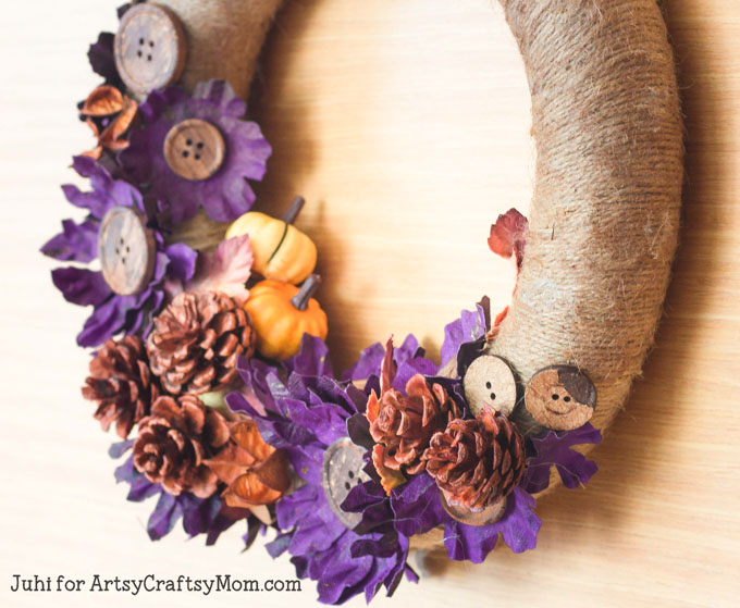 Easy DIY Fall Wreath with Twine and Pinecones in shades of brown, orange & a bit of purple and you have a front door ready for Fall & Halloween too!