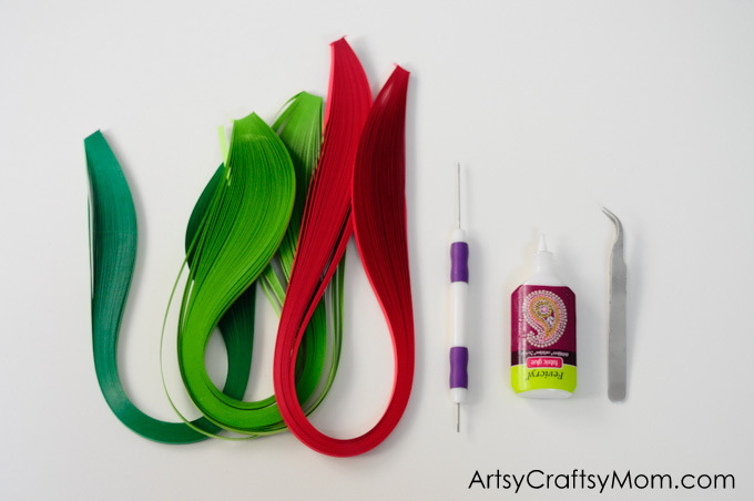 Wreaths are an integral part of Christmas decor! Make your own little version with this Paper Quilled Wreath - an easy Christmas ornament for your tree!