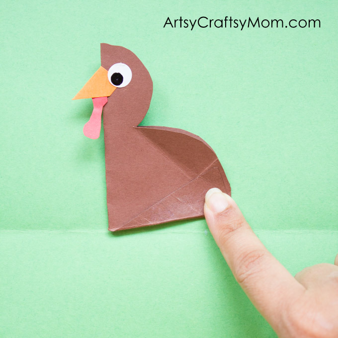 DIY Thanksgiving Turkey Popup Card - Here's a craft that pops right up to wish kids a Happy Thanksgiving Day! Easy Accordion fold turkey craft for kids.