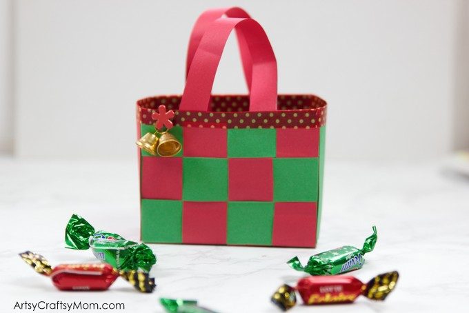 This DIY Christmas Paper Basket is the perfect craft to make and gift this holiday season! Fill it with candy, ornaments or tiny little gifts!