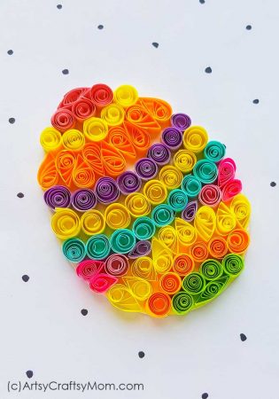 Colorful Easter eggs are the most identifying feature of this holiday! Make your own with this easy and bright Paper Quilling Easter Egg Craft!