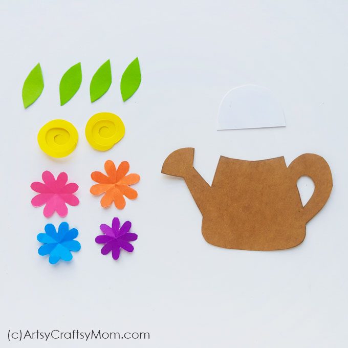 Few things describe spring as perfectly as this Spring Flowers in a Watering Can Paper Craft! This paper craft is perfect for a DIY card or as wall decor.