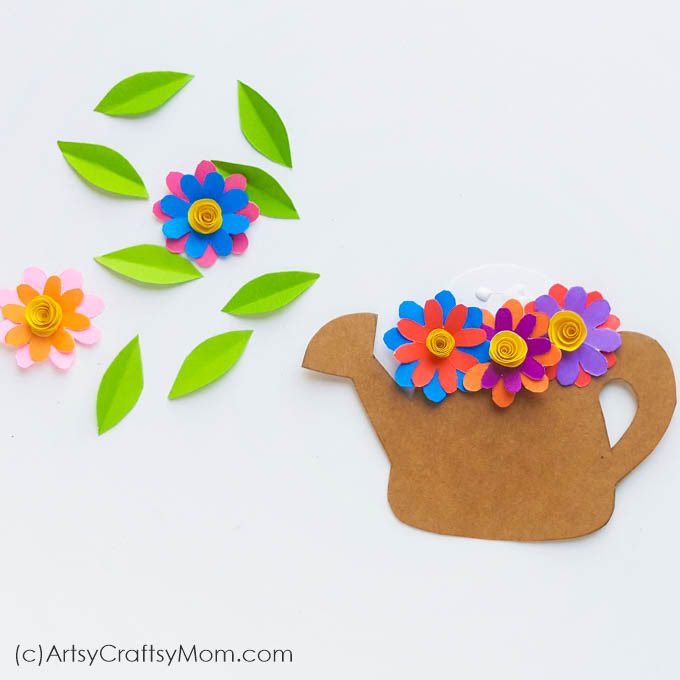 Few things describe spring as perfectly as this Spring Flowers in a Watering Can Paper Craft! This paper craft is perfect for a DIY card or as wall decor.