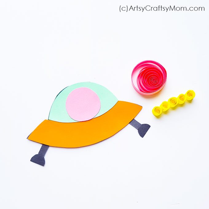 This cute paper alien spaceship craft is just what your little alien friend needs to come visit you! Easily made with craft paper and quilling strips.