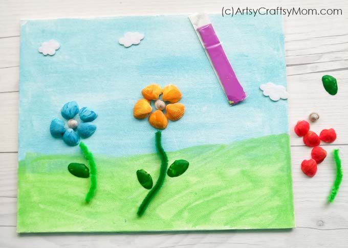 Collected shells while on holiday? Put them to use by making this beautiful Seashell Flower Garden Craft! Super easy craft that even young kids can make!