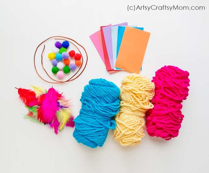 Say 'No' to nightmares with this Easy Pom Pom Dream Catcher Craft! With colored yarn and pom poms, this is an easy craft that'll brighten up your room!