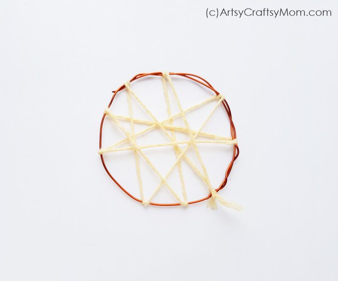 Say 'No' to nightmares with this Easy Pom Pom Dream Catcher Craft! With colored yarn and pom poms, this is an easy craft that'll brighten up your room!