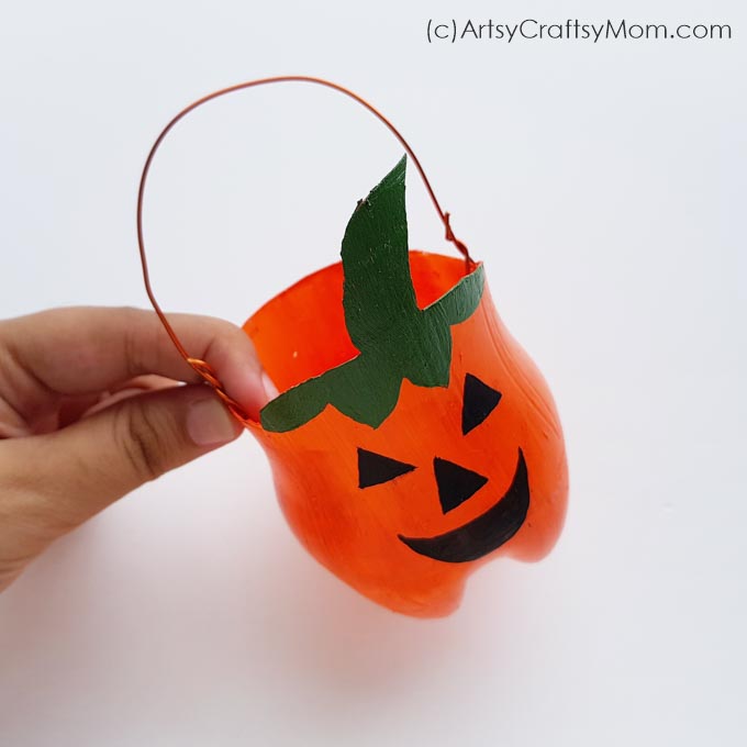 Learn how to make this cute Halloween pumpkin or Plastic Bottle Jack O Lantern Craft luminary from a 2-liter soda pop bottle. 