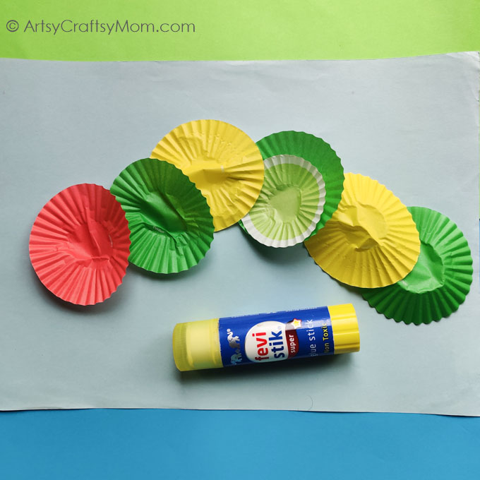 This colorful Cupcake Liner Caterpillar Craft goes perfectly with The Hungry Caterpillar, or any book about colors! Perfect spring craft for kids!