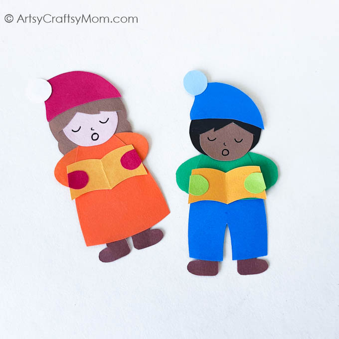 Popsicle Stick Christmas Carolers Craft 10 This Super Cute Popsicle Stick Christmas Carolers Craft is sure to bring a smile to your face! Use it as a bookmark, ornament or gift tag!