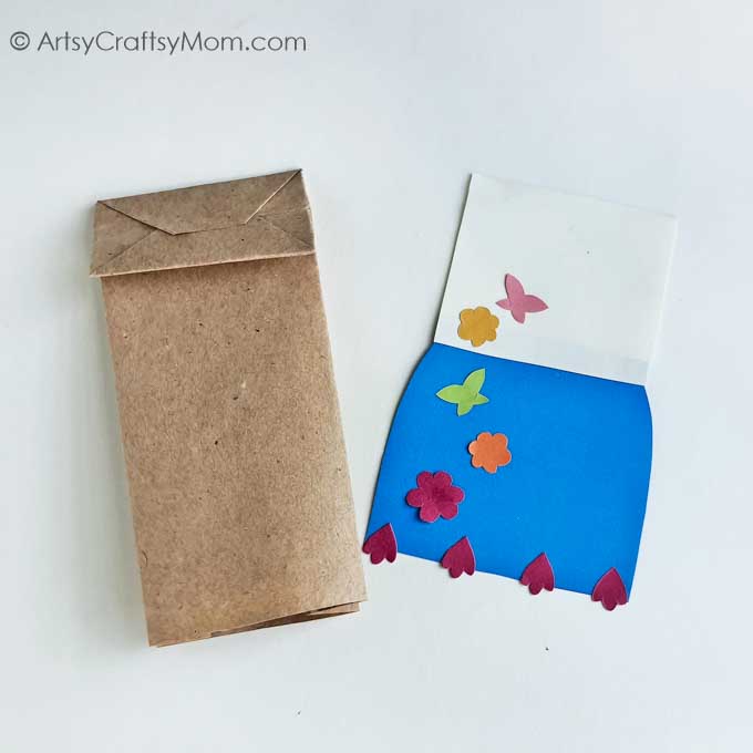 Encanto fans will love this adorable Paper Bag Mirabel Craft! Just download, print and follow the instructions to make this easy peasy project!