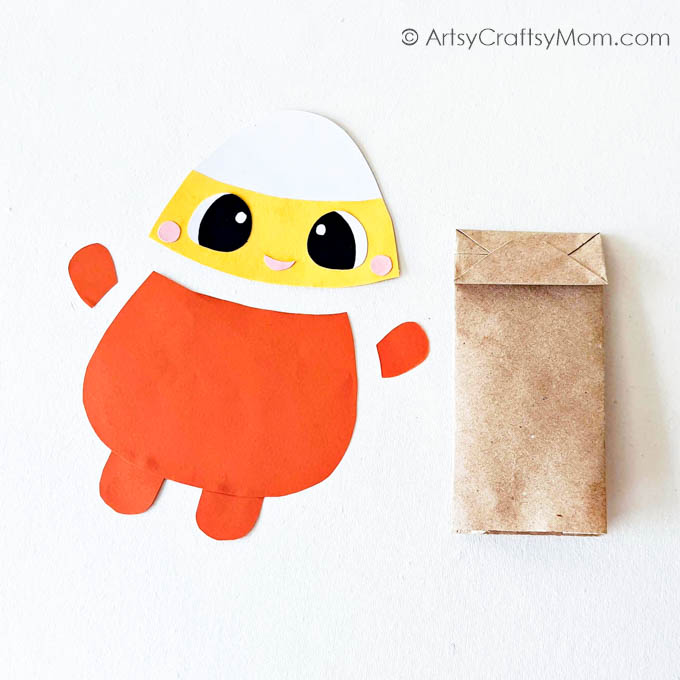 This cute little Paper Bag Candy Corn Puppet Craft is just what you need to add some color to your Halloween puppet show; & they're easy to make!