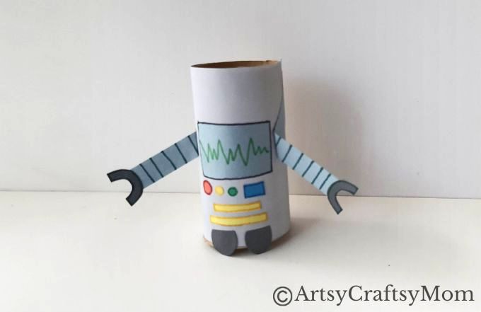 Attach the eyes and the mouth cutout on the head pattern of the robot figure.