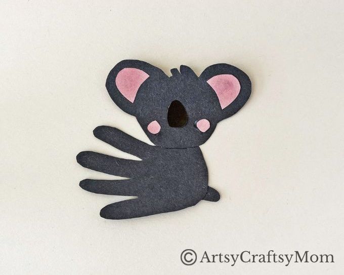 Here's a super cute Handprint Koala Craft for Kids to make with basic craft supplies - and their handprints! Great for learning about marsupials!