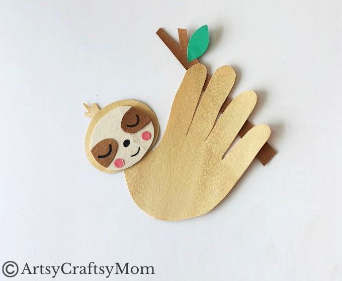 Kids will love making this cute Handprint Sloth Craft - especially since they can see their own handprints in it! Perfect for preschoolers & young kids,
