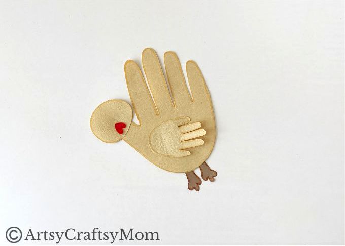 Here's a cute little handprint chicken craft that's super easy to make! Perfect for learning about farm life, domestic birds or about the letter C!