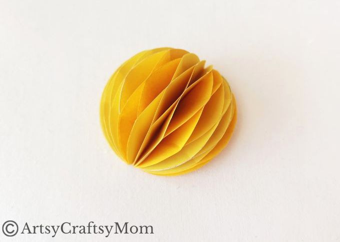 Try something different this holiday season - make a pretty 3D Christmas Ornament for your tree, entirely out of colored craft paper!