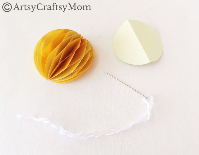 Try something different this holiday season - make a pretty 3D Christmas Ornament for your tree, entirely out of colored craft paper!