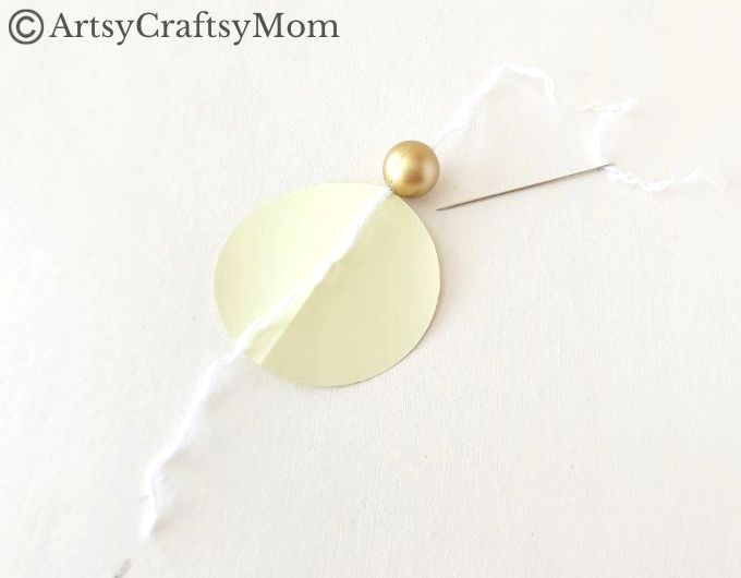 Try something different this holiday season - make a pretty 3D Christmas Ornament for your tree, entirely out of colored craft paper!