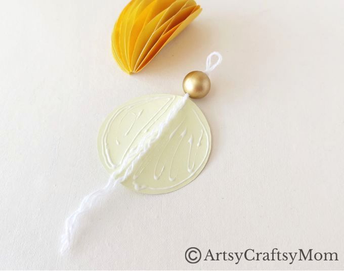 Try something different this holiday season - make a pretty 3D Christmas Ornament for your tree, entirely out of colored craft paper!