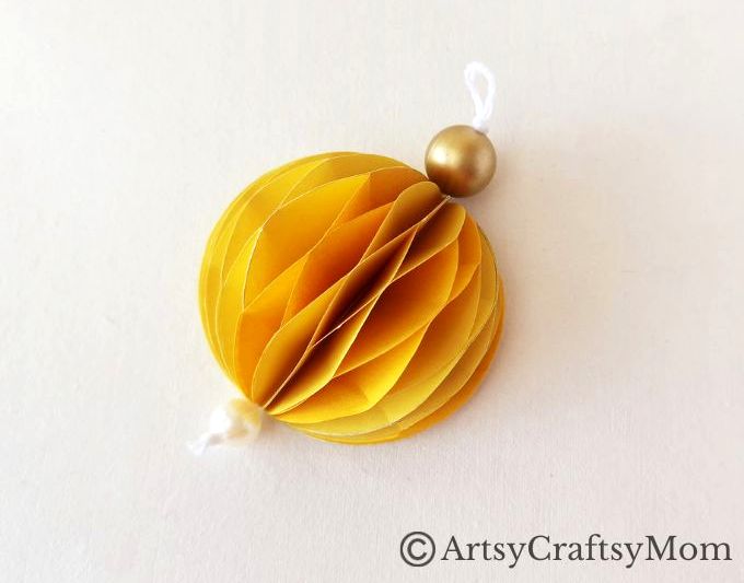Try something different this holiday season - make a pretty 3D Christmas Ornament for your tree, entirely out of colored craft paper!