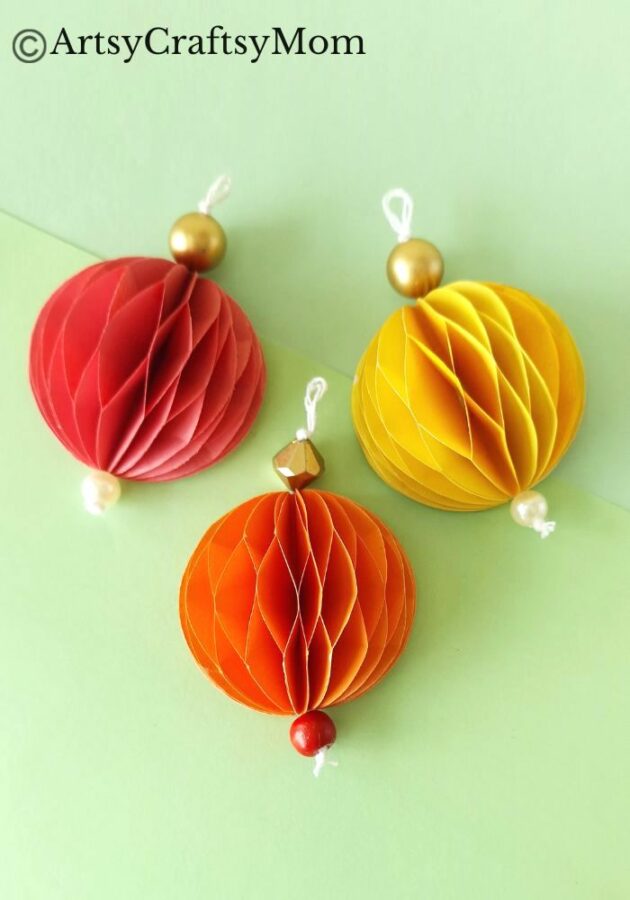 Try something different this holiday season - make a pretty 3D Christmas Ornament for your tree, entirely out of colored craft paper!