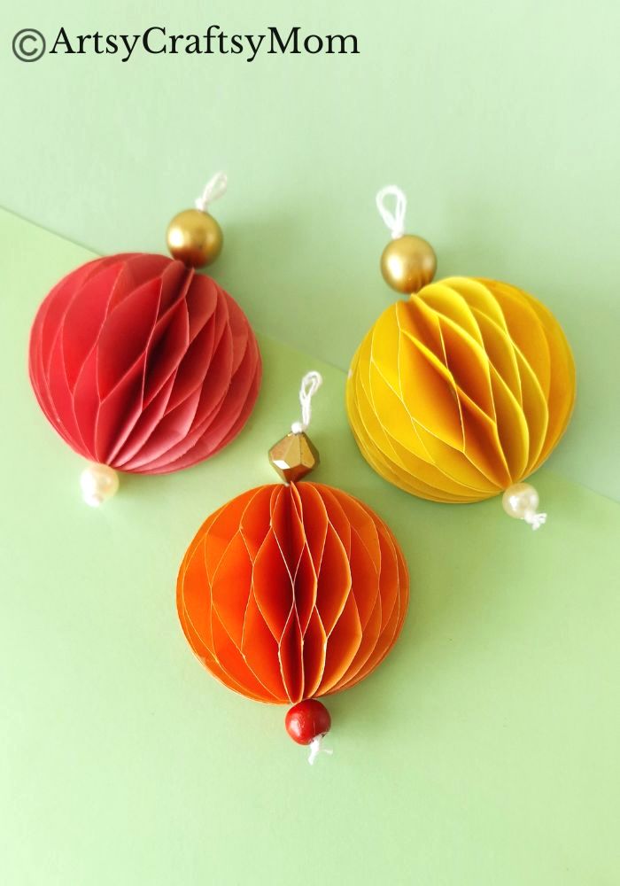 Try something different this holiday season - make a pretty 3D Christmas Ornament for your tree, entirely out of colored craft paper!