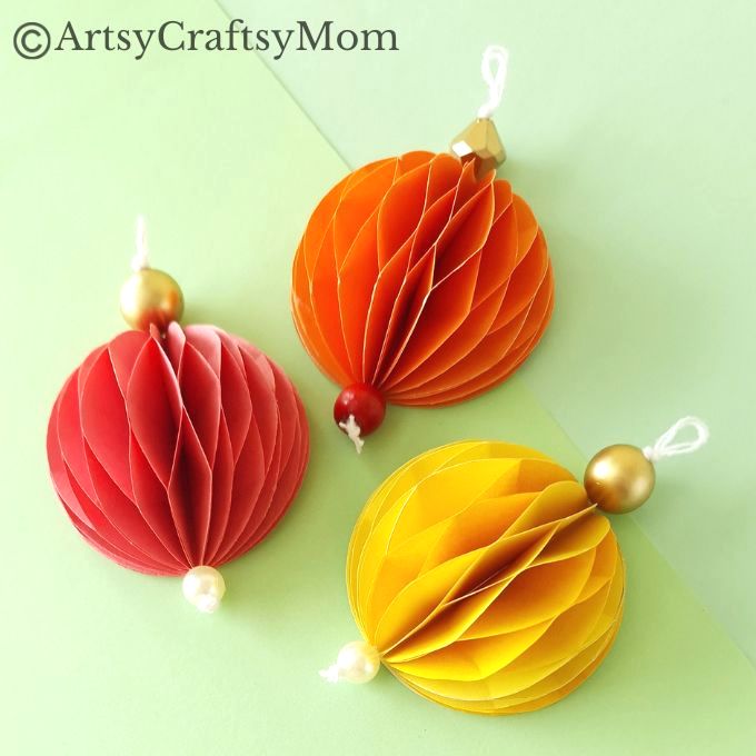 Try something different this holiday season - make a pretty 3D Christmas Ornament for your tree, entirely out of colored craft paper!