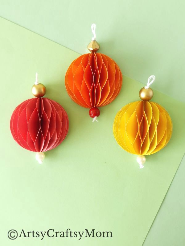 Try something different this holiday season - make a pretty 3D Christmas Ornament for your tree, entirely out of colored craft paper!