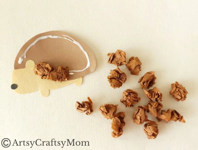 This crumpled paper hedgehog craft is super easy to make and great for young kids to exercise their fine motor muscles as they scrunch up paper!
