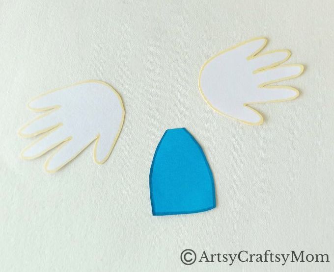 Handprint Angel Craft for Kids 8 We've got a pretty handprint angel craft for you today, and these angels look like they're really flying! Perfect Christmas craft for young kids to make.