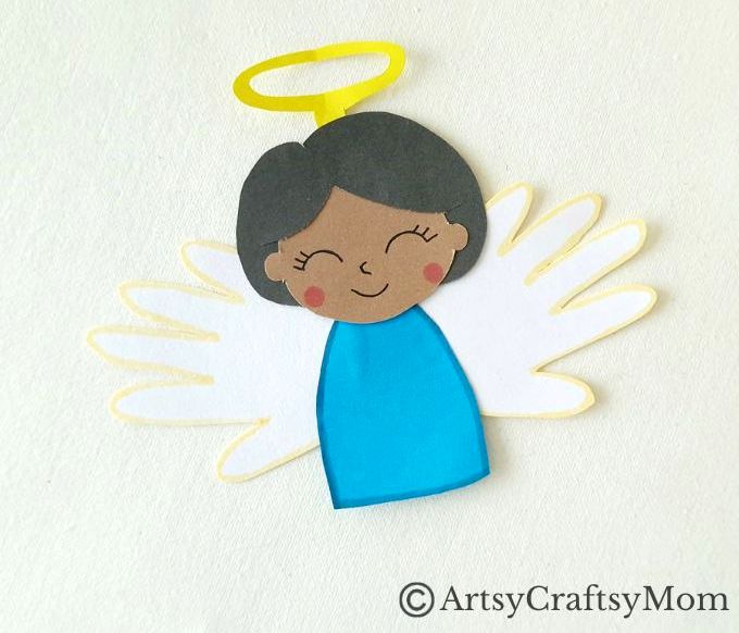 Handprint Angel Craft for Kids 11 We've got a pretty handprint angel craft for you today, and these angels look like they're really flying! Perfect Christmas craft for young kids to make.