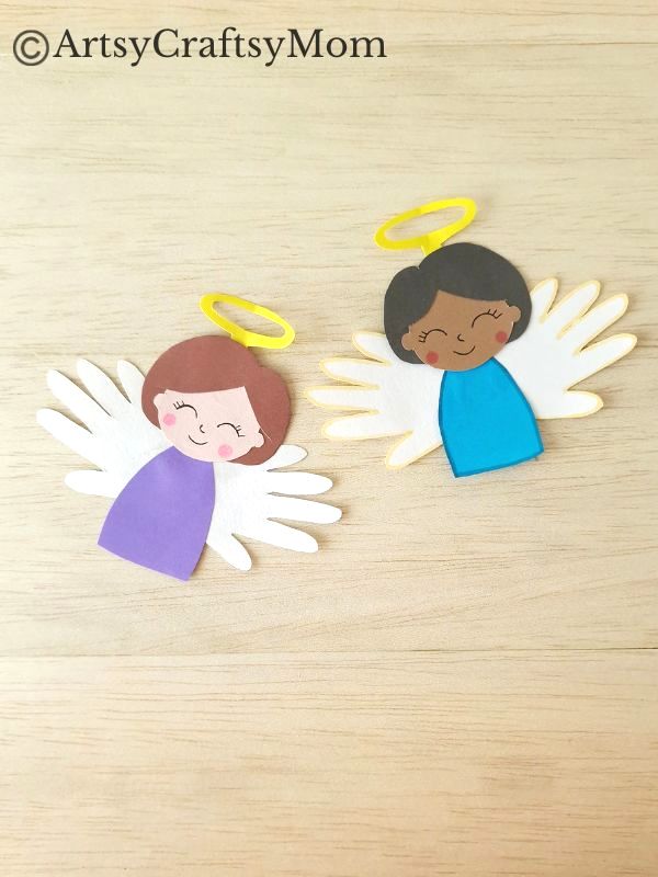 Handprint Angel Craft for Kids 13 We've got a pretty handprint angel craft for you today, and these angels look like they're really flying! Perfect Christmas craft for young kids to make.