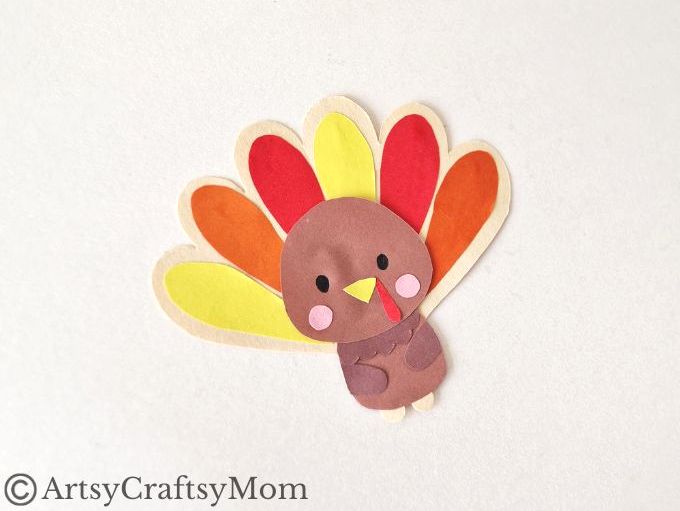Here's a turkey ready with a hug for you! This Thanksgiving, enjoy making this cute turkey hug bookmark out of craft paper - for you or your pals!