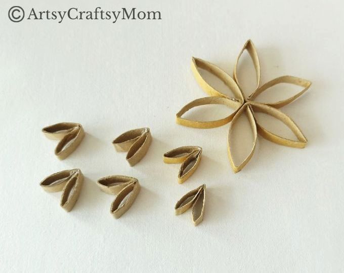 This DIY Toilet Paper Roll Snowflake Ornament is a gorgeous, rustic piece that will look wonderful hanging on your Christmas tree this year!