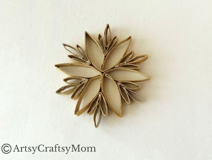 This DIY Toilet Paper Roll Snowflake Ornament is a gorgeous, rustic piece that will look wonderful hanging on your Christmas tree this year!