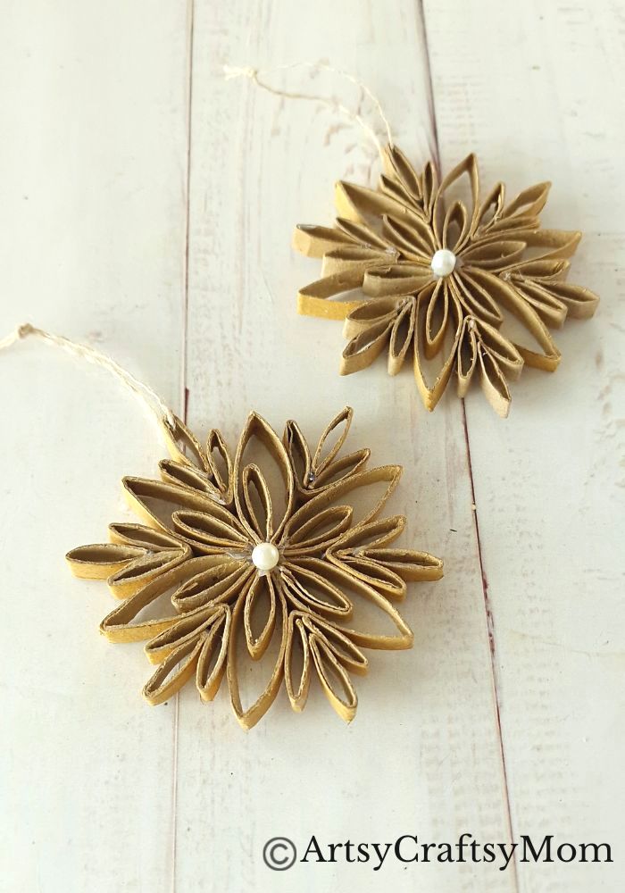 This DIY Toilet Paper Roll Snowflake Ornament is a gorgeous, rustic piece that will look wonderful hanging on your Christmas tree this year!