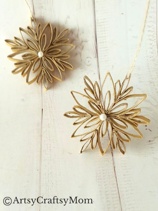 This DIY Toilet Paper Roll Snowflake Ornament is a gorgeous, rustic piece that will look wonderful hanging on your Christmas tree this year!