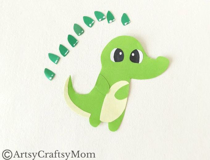 Add some bite to your reading with this fun alligator bookmark papercraft! Easy to make with just colored craft paper and basic craft supplies!