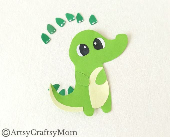 Add some bite to your reading with this fun alligator bookmark papercraft! Easy to make with just colored craft paper and basic craft supplies!