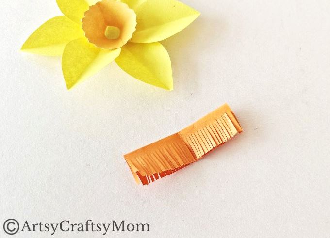 Here's a pretty daffodil papercraft for kids to make for spring or for Daffodil Day. It's a simple craft for which all you need is paper, scissors & glue!