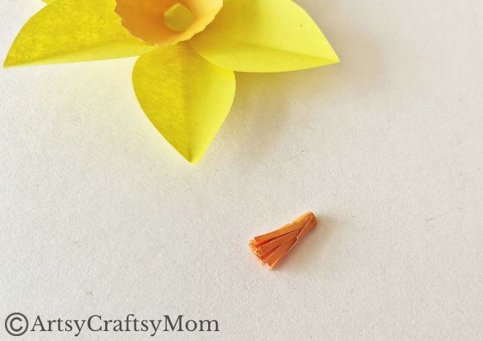 Here's a pretty daffodil papercraft for kids to make for spring or for Daffodil Day. It's a simple craft for which all you need is paper, scissors & glue!