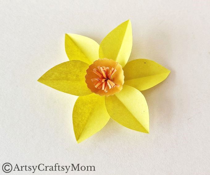 Here's a pretty daffodil papercraft for kids to make for spring or for Daffodil Day. It's a simple craft for which all you need is paper, scissors & glue!